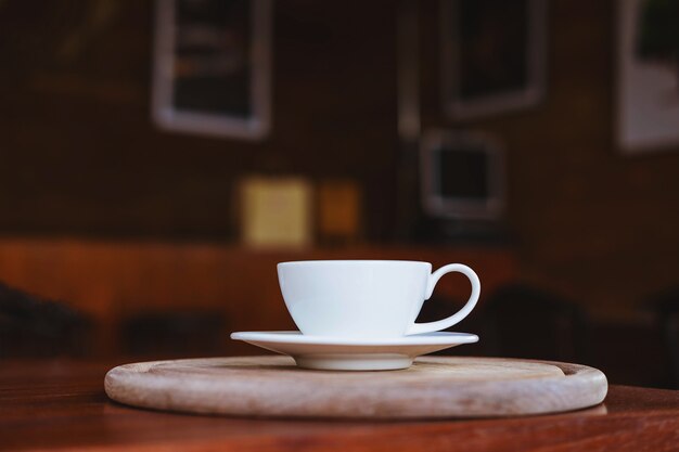 Coffee cups on a wooden table in a coffee shop