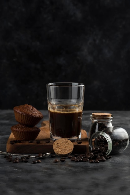 Coffee Drink with Sweets cookies and beans dark backround