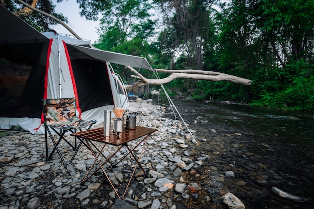 Coffee drip while camping near the river in nature park