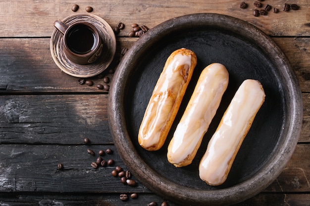 Coffee eclairs over wood