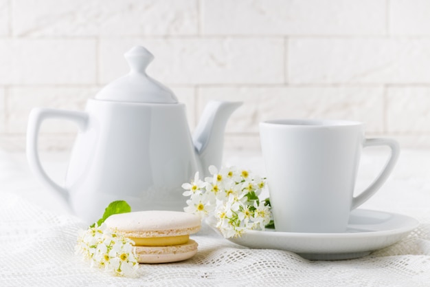 Coffee and French macaroons in white tone