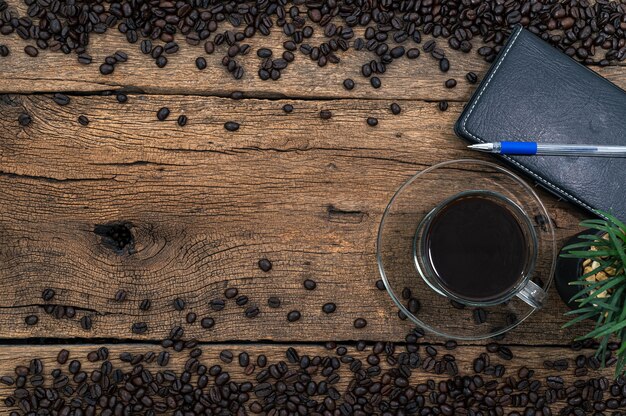 Coffee gives energy to work on the desk. top view