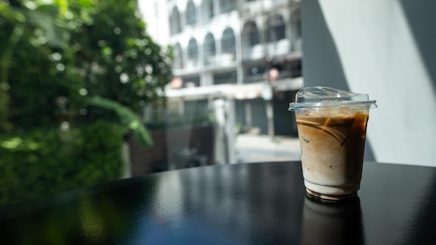 Coffee in a glass on the counter of a coffee shop