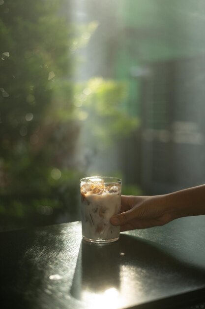 Photo coffee in a glass on a table in a cafe