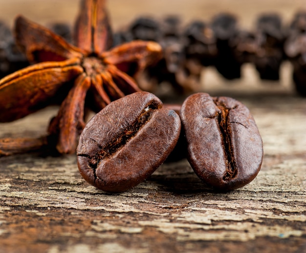 coffee grains on grunge wooden background