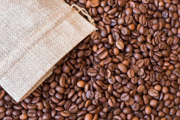 Coffee grains scatter out of the bag