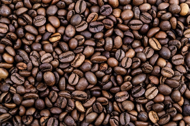 Coffee grains. surface of roasted coffee beans brown. 