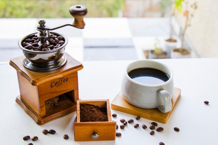 Photo コーヒーメーカーカップと豆 朝のコーヒー エネルギードリンク