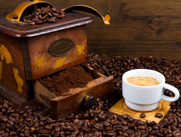 Coffee Grinder with Beans and coffee cup