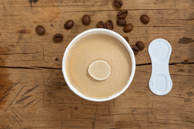 Coffee ice cream cup on wood table