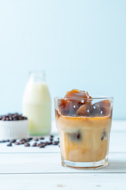 coffee ice cubes with milk on wood table