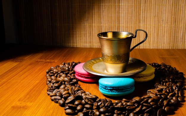 Coffee in an iron cup with cookies.