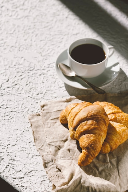 coffee juice and croissants on the table