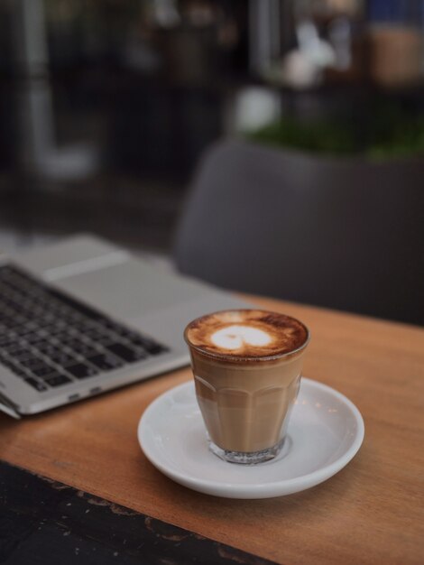 Coffee latte art in coffee shop cafe vintage color tone