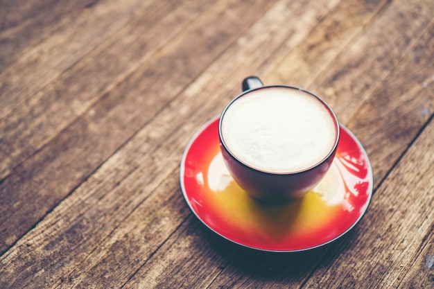 Coffee latte art in red cup