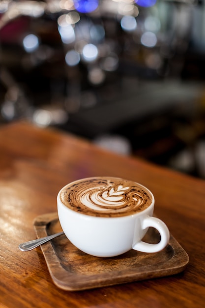 coffee latte art on wood table bar