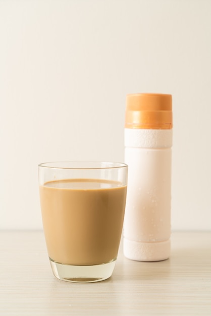 coffee latte glass with ready to drink coffee bottles on the table