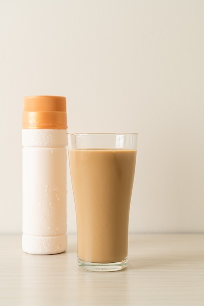 coffee latte glass with ready to drink coffee bottles on the table