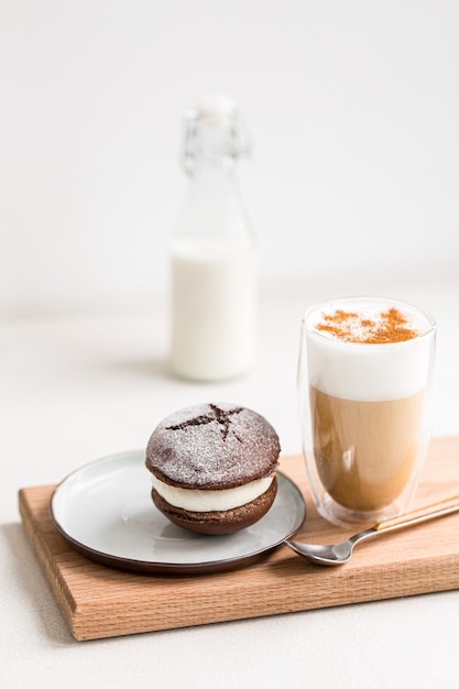 Coffee latte with whoopie pie cream dessert