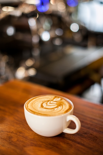 Coffee latte on wood table bar