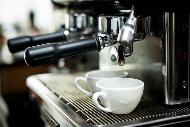 Photo coffee machine espressos shot in white cups