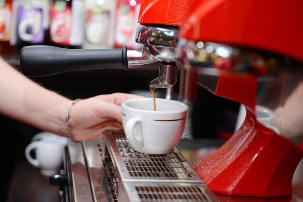 Coffee machine preparing cup of coffee close up