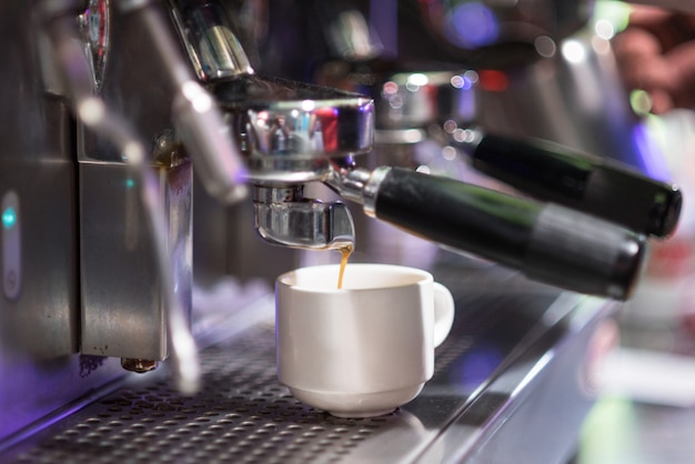 Coffee machine preparing espresso close up