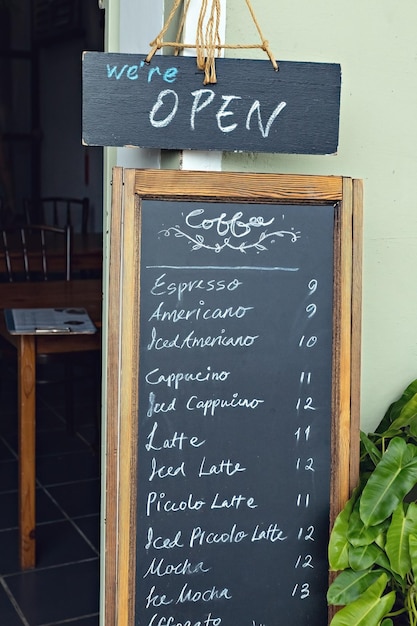 Coffee menu at the entrance of coffee shop