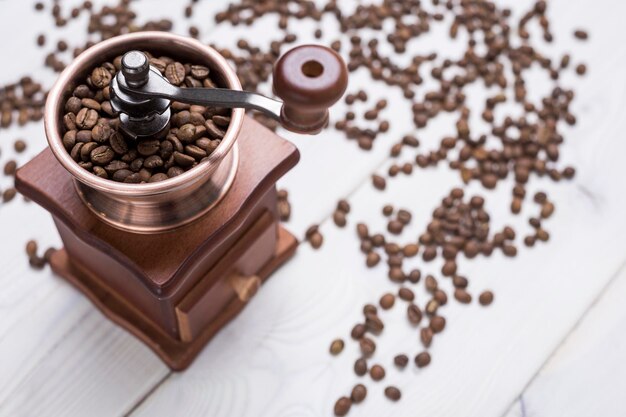 Coffee mill and beans on a table