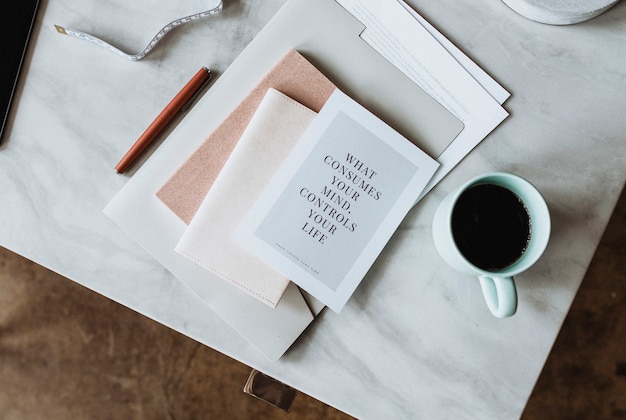 Coffee mug by a notebook