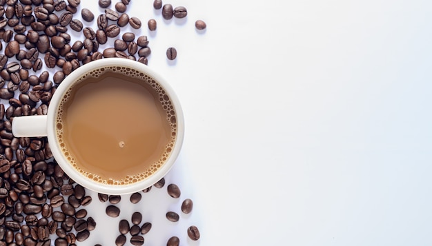 Coffee mug, coffee beans, white background scene