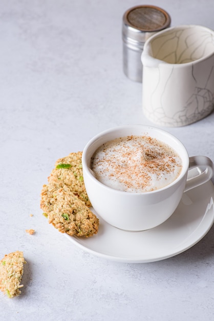 coffee in a mug with cinnamon and milk