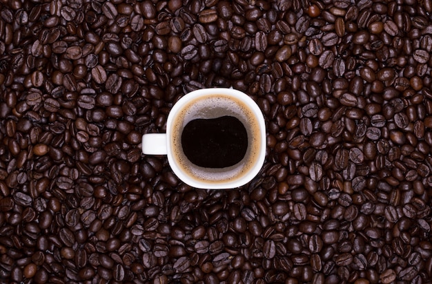 Coffee mug with coffee beans