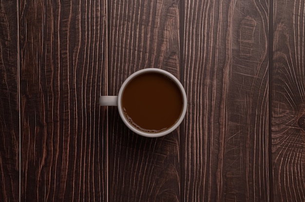 Coffee mug on wooden background