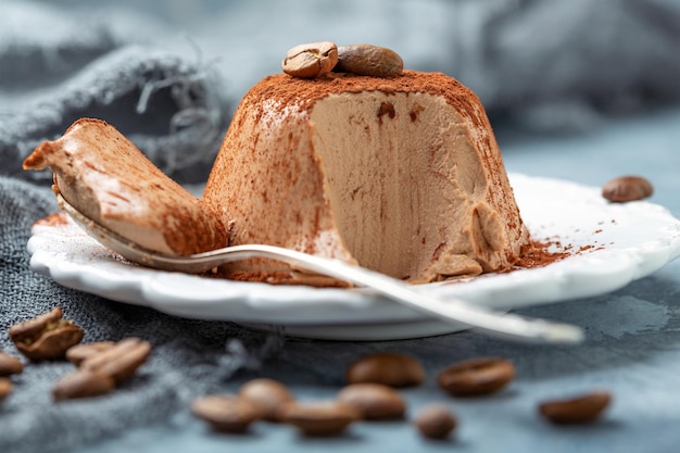 Coffee Panna cotta on a plate closeup