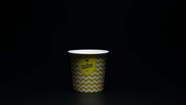 coffee paper cup on black background