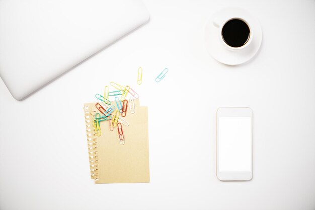 Coffee and phone on desk