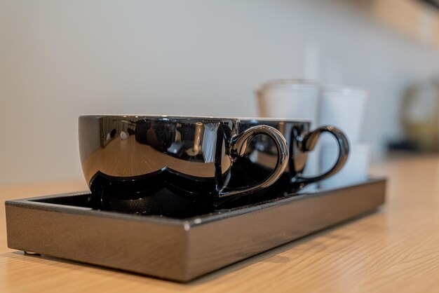 Coffee pods and cofee cups in a hotel room