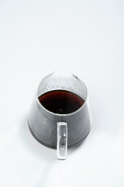 Coffee pot with hot coffee on a white background