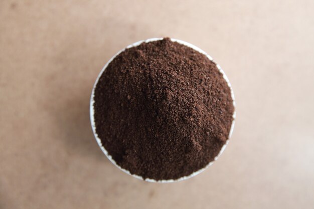 Coffee powder on wood background