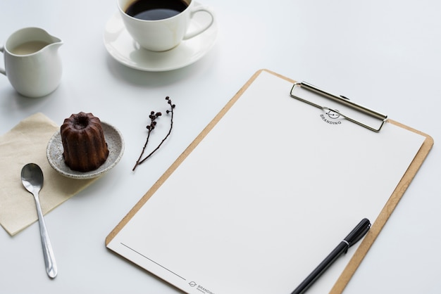 Coffee pudding and clipboard on the table