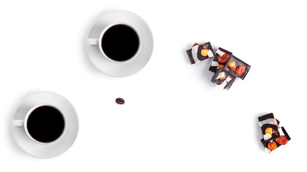Coffee and raw chocolate on a white background
