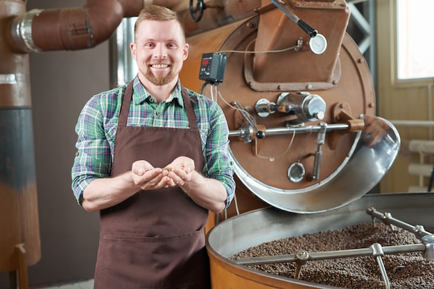 Coffee Roaster Posing by Machine