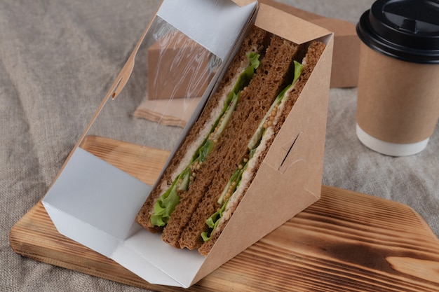 Coffee and sandwiches in craft box