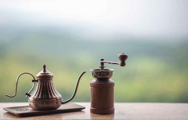 Coffee set on wooden table in a refreshing natural atmosphere