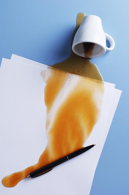 Coffee spilled on sheets of paper