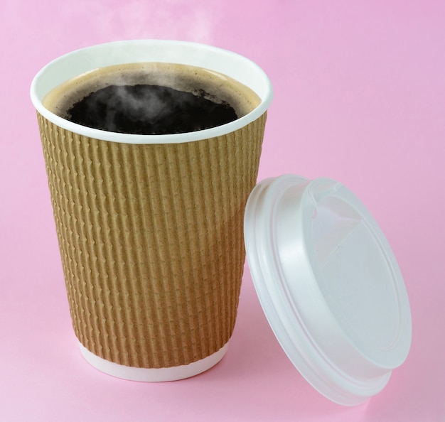 Coffee in take away cup on pink background