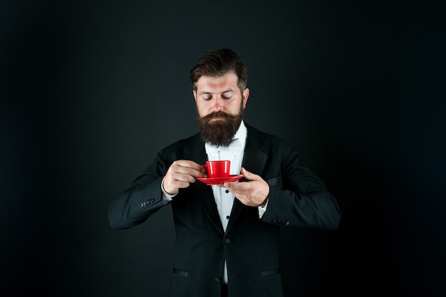 Coffee takes you to a whole other level. Bearded man drink coffee in morning. Businessman enjoy coffee aroma. Hot drink. Breakfast tea. Morning coffee. Relaxing mood.