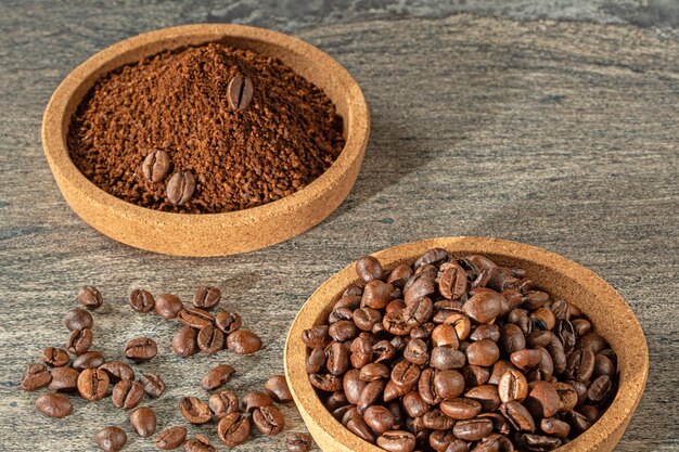 Photo coffee theme cork saucers filled with coffee beans and ground coffee granules