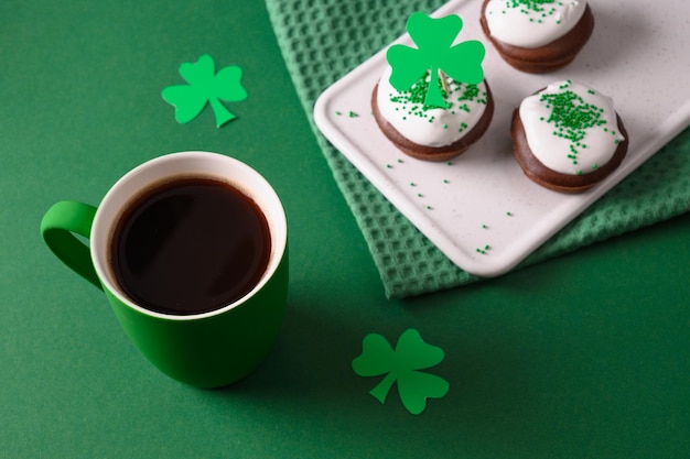 Coffee and three cupcakes for celebration st patricks day